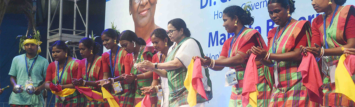 Hon'ble Chief Minister Mamata Banerjee with the Adivasi dance troup during the  civic reception at  Netaji Indoor Stadium in Kolkata on 27 March 2023